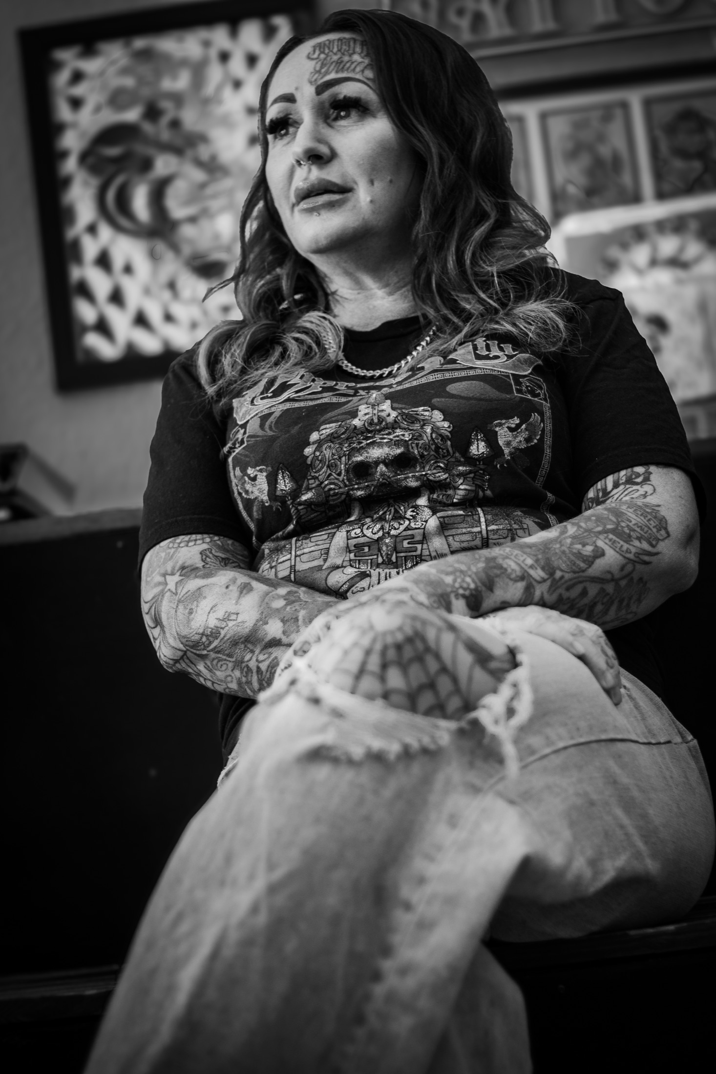 Manda, owner of Sublime Tattoo, seated inside the shop